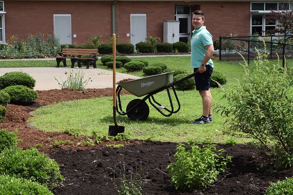 adding soil3 compost to rain and pollinator garden