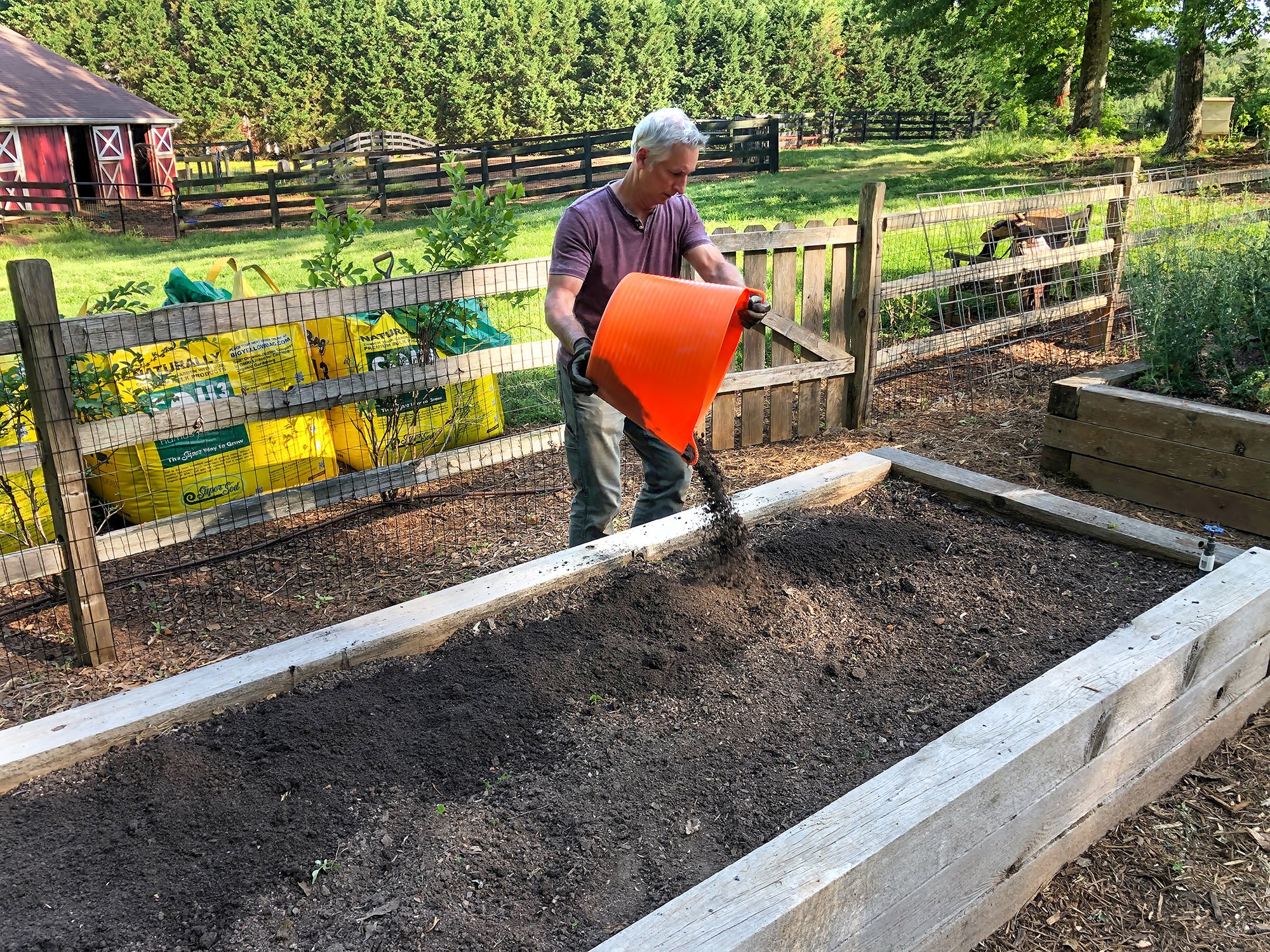 Joe Lamp'l topping off his raised beds with Soil3 compost